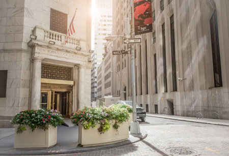 NEW YORK CITY, NY - OCTOBER 4, 2015: The side entrance of New York Stock Exchange and a street sign of Wall Street  in New York City. The Exchange building was built in 1903.のeditorial素材