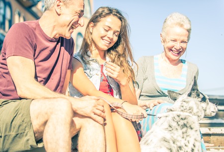Happy family with dog in Santa monica, Los angeles. concept about people, family and happinessの写真素材