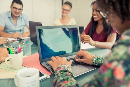Start up business in an office. Team at work on a new projectの写真素材