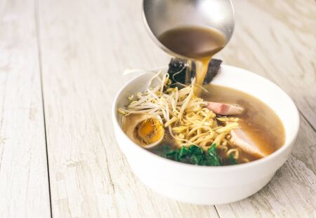 Japanese ramen bowl on wood background. Tasty japanese foodの写真素材