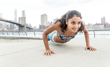 Woman making push up training in New york cityの写真素材