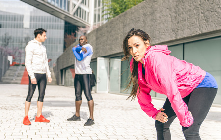 Group of urban runners making sport in an urban areaの写真素材