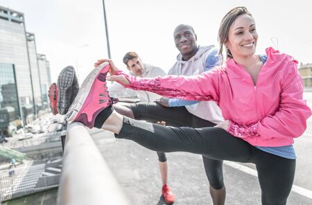 Group of urban runners making sport in an urban areaの写真素材