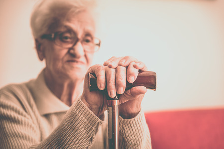 Old woman with caneの写真素材
