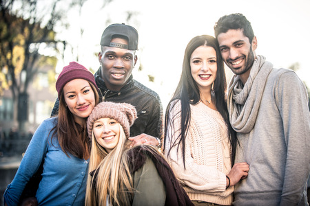 Happy friends walking in the cityの写真素材