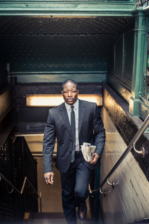 Confident businessman. Successful young man in full suit exiting the subway station in New Yorkの写真素材