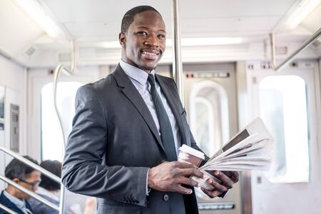 Businessman in full suit in New York subway metroの写真素材