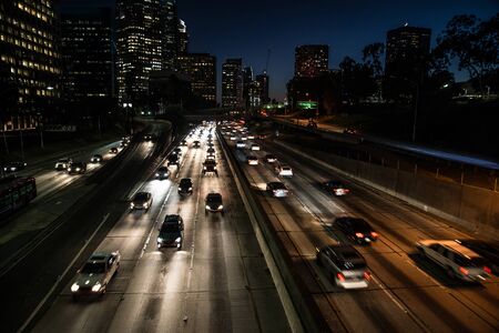 Traffic on a highway, many cars driving