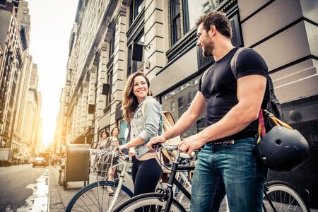 Couple of cyclist in New York - Couple of lovers sighseeing Manhattan on bikesの写真素材