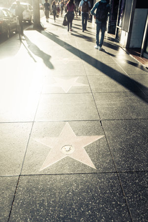 HOLLYWOOD, CA - OCTOBER 12, 2016: People visit Walk of Fame in Hollywood. Hollywood Walk of Fame features more than 2,500 stars with inscribed celebrity names.のeditorial素材