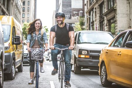 Couple of cyclist in New York - Couple of lovers sighseeing Manhattan on bikesの写真素材