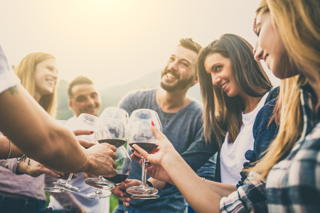 Group of friends at restaurant outdoors - People having dinner in a home garden