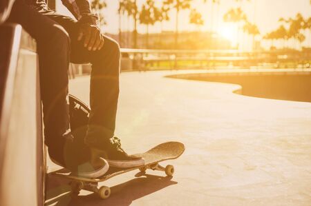 Professional skater resting a bit at the skate parkの写真素材