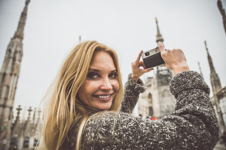 Milan,woman on excursion on the top of the cathedralの写真素材
