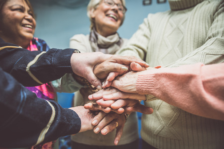 Group of seniors making activities inside the hospiceの写真素材