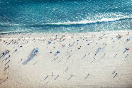 Santa Monica beach, drone view - People sunbathing on the beach and swimming in the oceanの写真素材