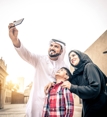 Arabic family playing with childの写真素材