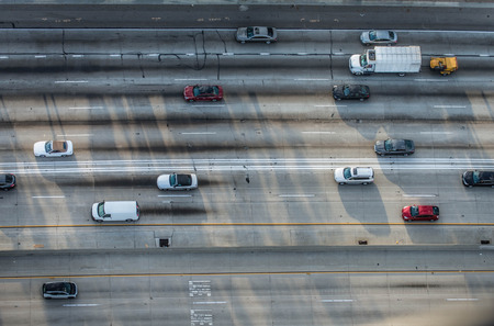 Cars driving on a highway, bird's eye view