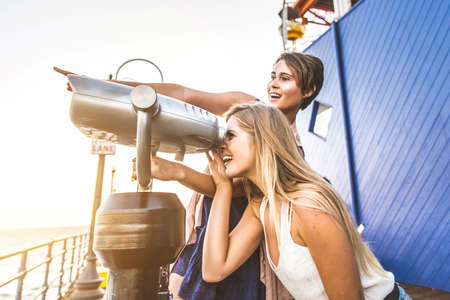 Two girls playing and having fun outdoorsの写真素材