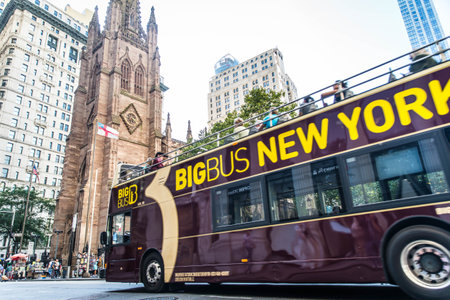 New York, USA - SEPTEMBER 17, 2017: Trinity Church in Lower Manhattan and street with tourists and traffic New York USA. It is a historic parish church near Wall Street and Broadway.のeditorial素材