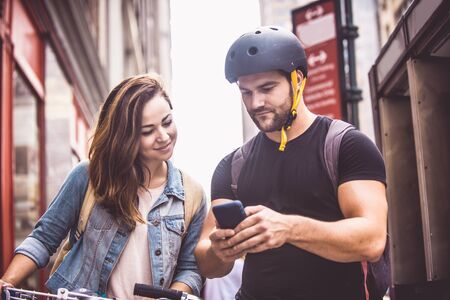 Couple of cyclist in New York - Couple of lovers sighseeing Manhattan on bikesの写真素材