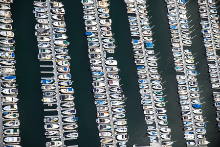 Ships and boat parked in a harbourの写真素材