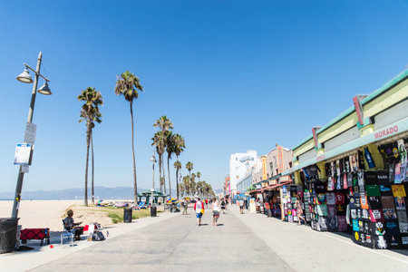 VENICE BEACH, USA - SEPTEMBER 29, 2016: The crowded Venice Beach Boardwalk. Lots of people are...