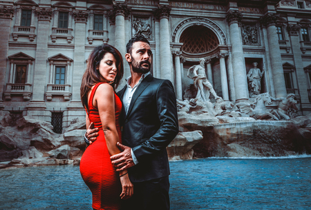 Beautiful couple dating in Rome, Italy -  Boyfriend and girlfriend at Trevi's fountainの写真素材