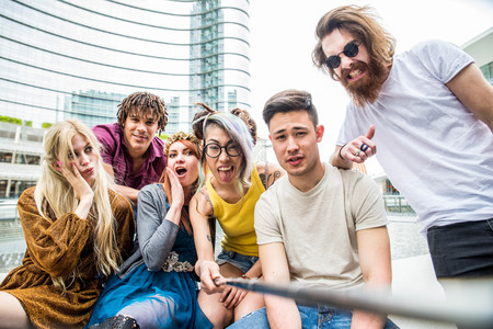 Group of friends bonding and having fun outdoorsの写真素材