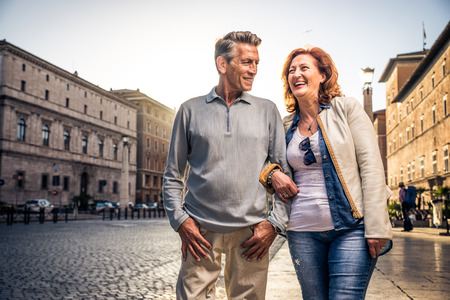 Senior couple at the Vaticano, Rome - Happy tourists visiting italian famous landmarksの写真素材