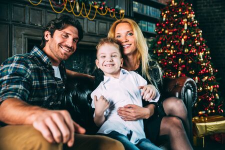 Family home portrait. Parents and son spending time together