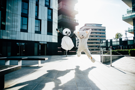 Panda and teddy bear having fun around the cityの写真素材