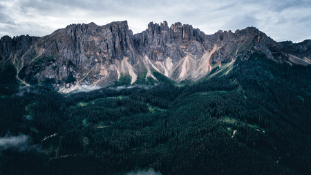 Aeril view of mountains and forest in europe on the alps