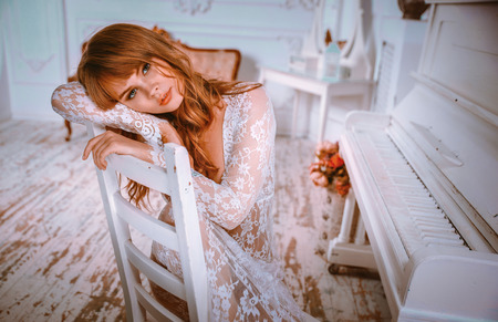 Beautiful woman posing in her apartmentの写真素材