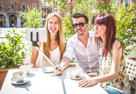 Multi-ethnic group of teenagers taking a selfieの写真素材