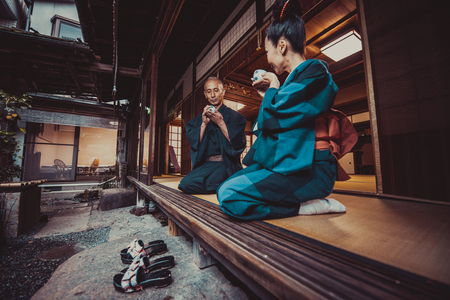 Senior couple lifestyle moments in a traditional japanese houseの写真素材