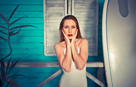 Beautiful girl posing in her summer houseの写真素材