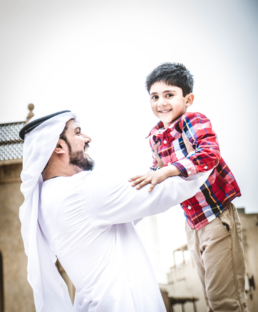 Arabic family playing with childの写真素材