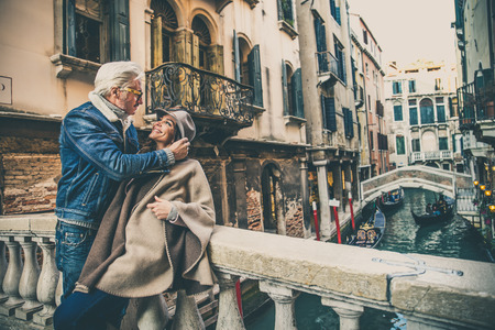 Beautiful couple in Venice, Italy - Lovers on a romantic date and kissing in Saint Mark Square, Veniceの写真素材