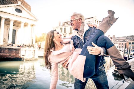 Beautiful couple in Venice, Italy - Lovers on a romantic date and kissing in Veniceの写真素材