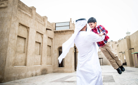 Arabic family playing with child