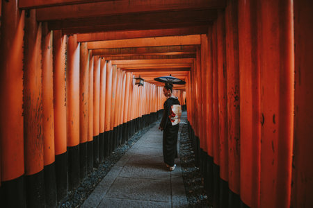 Beautiful japanese senior woman walking in the fushimi inari shrine in Kyotoのeditorial素材