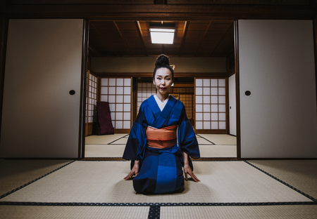 Beautiful japanese woman in a traditional japanese houseの写真素材