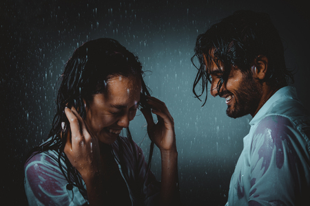 Couple sharing romantic moments under the rainの写真素材