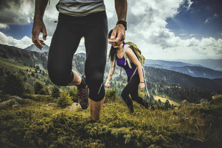 Couple making trekking on the mountainの写真素材