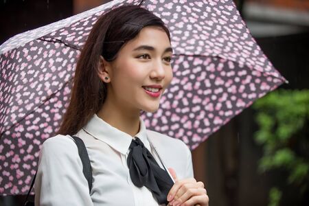 Pretty japanese student poirtait outdoors - Asian girl going to college schoolの写真素材