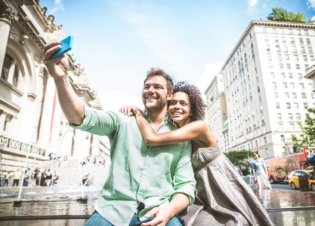 Couple taking a selfie -  Tourists sightseeing New Yorkの写真素材