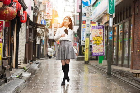 Pretty japanese student poirtait outdoors - Asian girl going to college schoolのeditorial素材