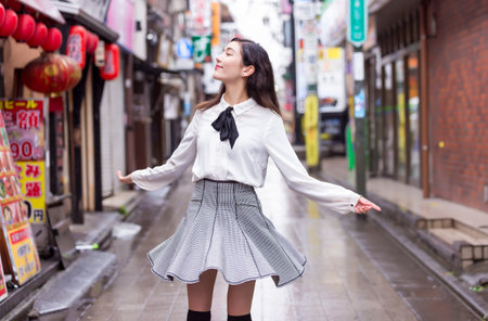 Pretty japanese student poirtait outdoors - Asian girl going to college schoolのeditorial素材