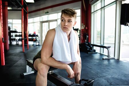 Muscular athletes training in a crossfit gym - Functional training workout in a gymの写真素材